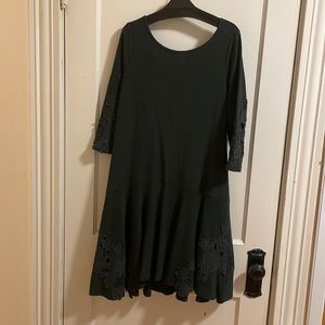 Like new Anthropologie sweater dress with floral detailing.